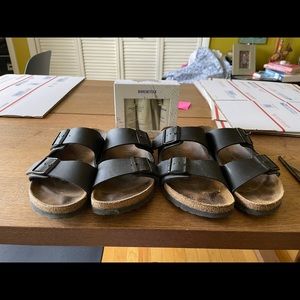 Two pairs black Birkenstocks 8.5 with Birkenstock deluxe shoe care kit